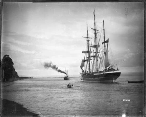 Halcione barque, port stern, being towed