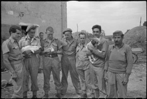 New Zealand and Greek soldiers at a farm in Italy, during World War 2