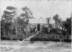 Cottage with cabbage trees - Photograph taken by an unknown photographer