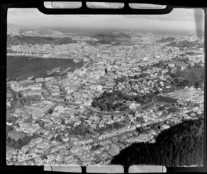 View south over the suburb of Thorndon with Tinakori Road and the Botanic Gardens in foreground to the Houses of Parliament and the central business district and harbour beyond, Wellington City