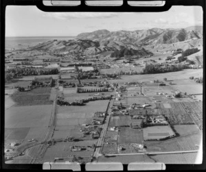 Stoke with Main Road in foreground, looking north with pastoral fields to mountains and Tasman Bay beyond, Nelson
