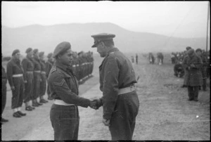 Corporal James King, New Zealand World War 2 soldier, receiving the Military Medal from General Freyberg, Florence, Italy
