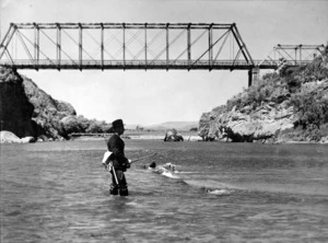Manawatu River and bridge, with man fishing