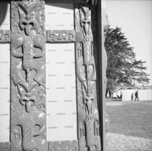 Maori wood carvings on the exterior of Tu Kaki meeting house at Te Kaha