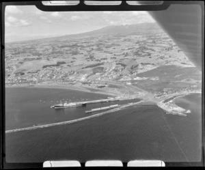 New Plymouth, view of Port Taranaki, includes ship, wharf, housing and shoreline