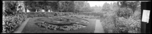 Large circular lily pond with statuette in centre, in the grounds of `Fernside' near Featherston