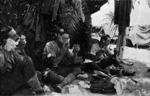 World War 1 soldiers Charley Fitton, Bunkall and A F Buckland of 11th Squadron, Auckland Mounted Rifles, shaving under palms at Bir-Et-Maler, Palestine