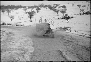 New Zealand jeep driving through snow, Italy, during World War 2