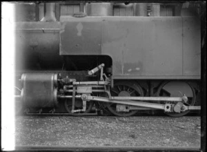 Closeup view of a We class steam locomotive, showing the valve motion of the axle.