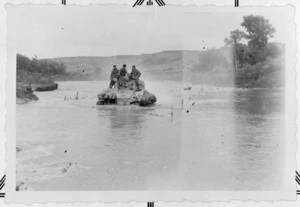 New Zealand soldiers on a tank in the Biferno River, Italy, during World War 2