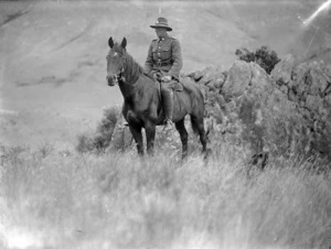 Cyril McCusker on horseback, in the uniform of a mounted rifleman, Taylor Pass, Marlborough
