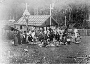 Group, including Father James McDonald, alongside a Roman Catholic Church at Opanaki, Northland