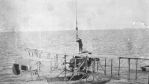 Seaplane hoisted above the sea from the deck of HMS Ark Royal