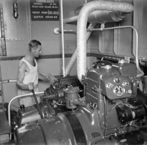 Paton, H fl 1942 (Photographer) : 2nd NZEF Engineer in the engine room of a lighter at a Syrian port
