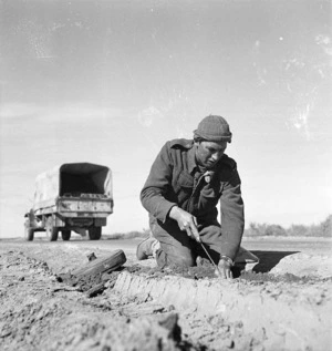 Paton, H fl 1942 (Photographer) : New Zealand engineer extracting mines in Tripoli, Libya