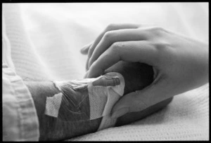 Photograph of Nurse Julia Barton's hand taking a pulse, New Zealand