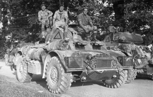 World War Two soldiers of the 2nd New Zealand Divisional Cavalry Battalion on an armoured car in Italy