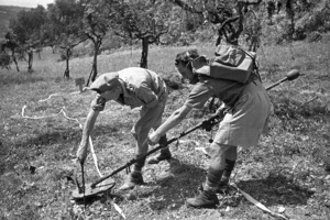 Kaye, George, b 1914 (Photographer) : World War 2 New Zealand soldiers using a mine dectector, Florence region, Italy