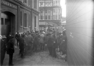 Group of men with a horse, on Queen's Wharf, Wellington, during the 1913 Waterfront Strike