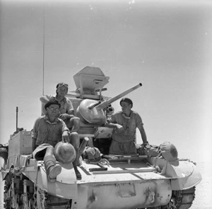 Soldiers of the New Zealand Divisional Cavalry on a tank at El Alamein, Egypt - Photograph taken by H Paton