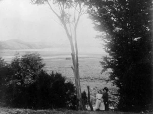 Scene at Pauatahanui, with trees, woman and children