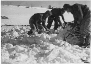 World War 2 New Zealand troops digging out a troop command post after a blizzard, Castelfrentano, Italy