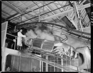 Steam cleaning a car body at the Ford Motor Company in Lower Hutt - Photograph taken by Edward Percival Christensen