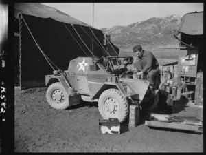 Corporal Doug Pilcher servicing a scout car at K Force Transport Platoon workshops - Photograph taken by Ian Mackley