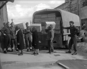 Japanese labourers unload stores from the New Zealand Patriotic Fund Board, Chofu, Japan