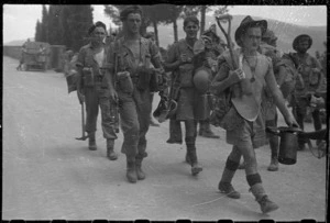 World War 2 New Zealand soldiers of 26 Battalion coming out from the front line, Lignano area, Italy