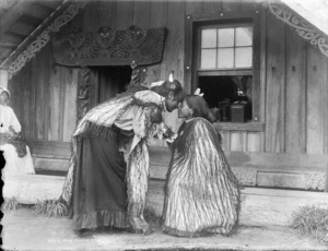 Women greeting each other with a hongi
