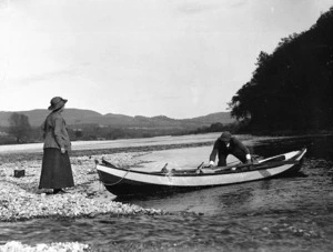 Man and woman with rowboat, Tongariro River