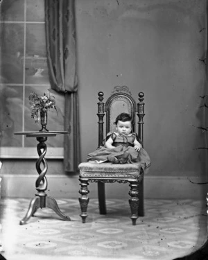 Portrait the Spurdle baby seated on a chair