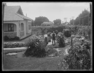 Unidentified family in the garden of their home, Hastings