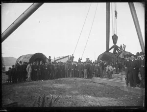 Group of officials standing in front of the new sheer-legs at Port Chalmers, 1891 for the first official testing.