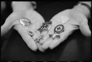 Medals dislayed on the hands of Nurse Maureen Laws