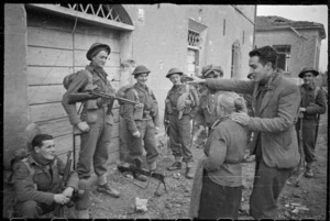 World War 2 New Zealand infantrymen talking to civilians in Faenza, Italy