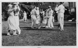 Couples dancing at a garden party