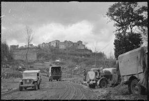 World War 2 transport approaching one of the ruined villages in the New Zealand sector of the Monte Cassino front, Italy