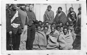 Maori prisoners, members of the Hauhau church, under guard on board a prison hulk in Wellington Harbour