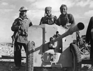 Three members of the Maori Battalion with caputured anti-tank guns, near Gazala, Egypt
