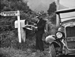Farmer picking up his mail from a rural delivery box, Ruapehu district