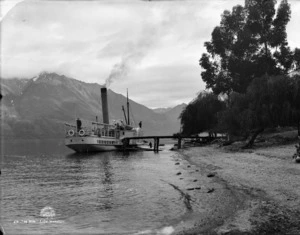 Scene at Lake Wakatipu with paddle steamer Mountaineer