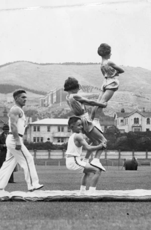 Robson, Edward Thomas, fl 1920s-1940s? : Alf Jenkins and children doing gymnastic exercises, Basin Reserve, Wellington
