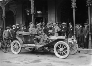 Unidentified men in a "world touring" 1910 Hupmobile motorcar, outside the United Service Hotel, Cathedral Square, Christchurch