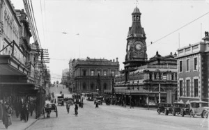View of people, business premises, cars and trams in Princes Street, Dunedin