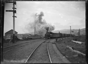 Train leaving Wellington, passing Pipitea; class Wb locomotive.