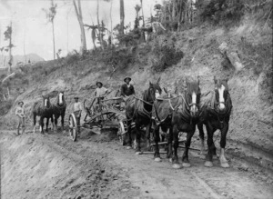 Road construction, with horse drawn machinery and workers