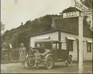 Family outside tea and refreshment rooms at top of Rimutakas, Wellington