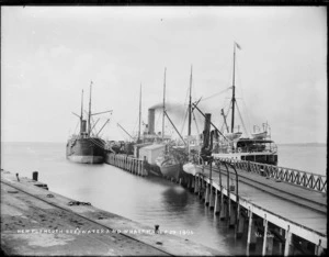 Unidentified ships at a wharf and breakwater in New Plymouth